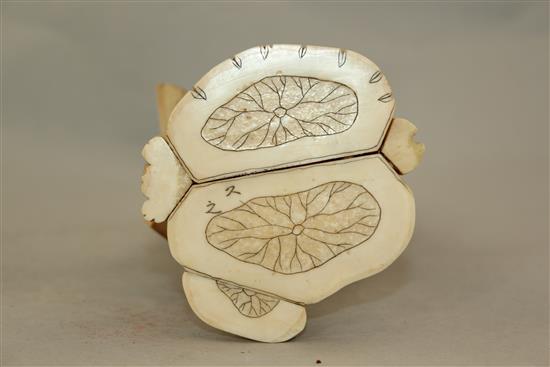 A Japanese sectional walrus ivory figure of a fan seller, early 20th century, 27.5cm